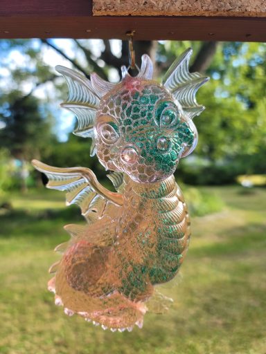 Orange and green baby dragon