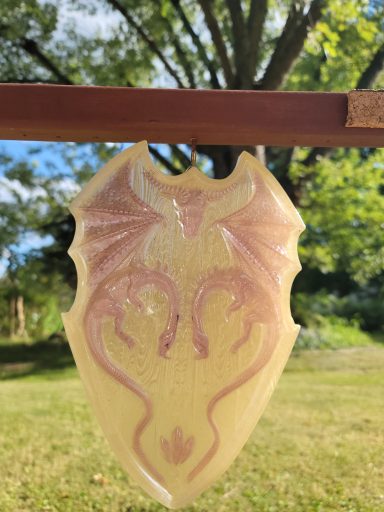 Yellow shield with red head-to-head dragons