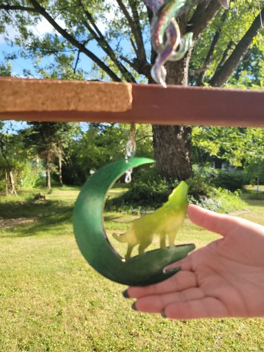 Green moon wolf baying