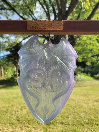 Purplish dragons head-to-head shield